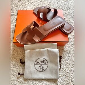 AUTHENTIC HERMES ORAN SANDALS SZ 41. BROWN. INCLUDES HERMES BOX AND 2 DUST BAGS.